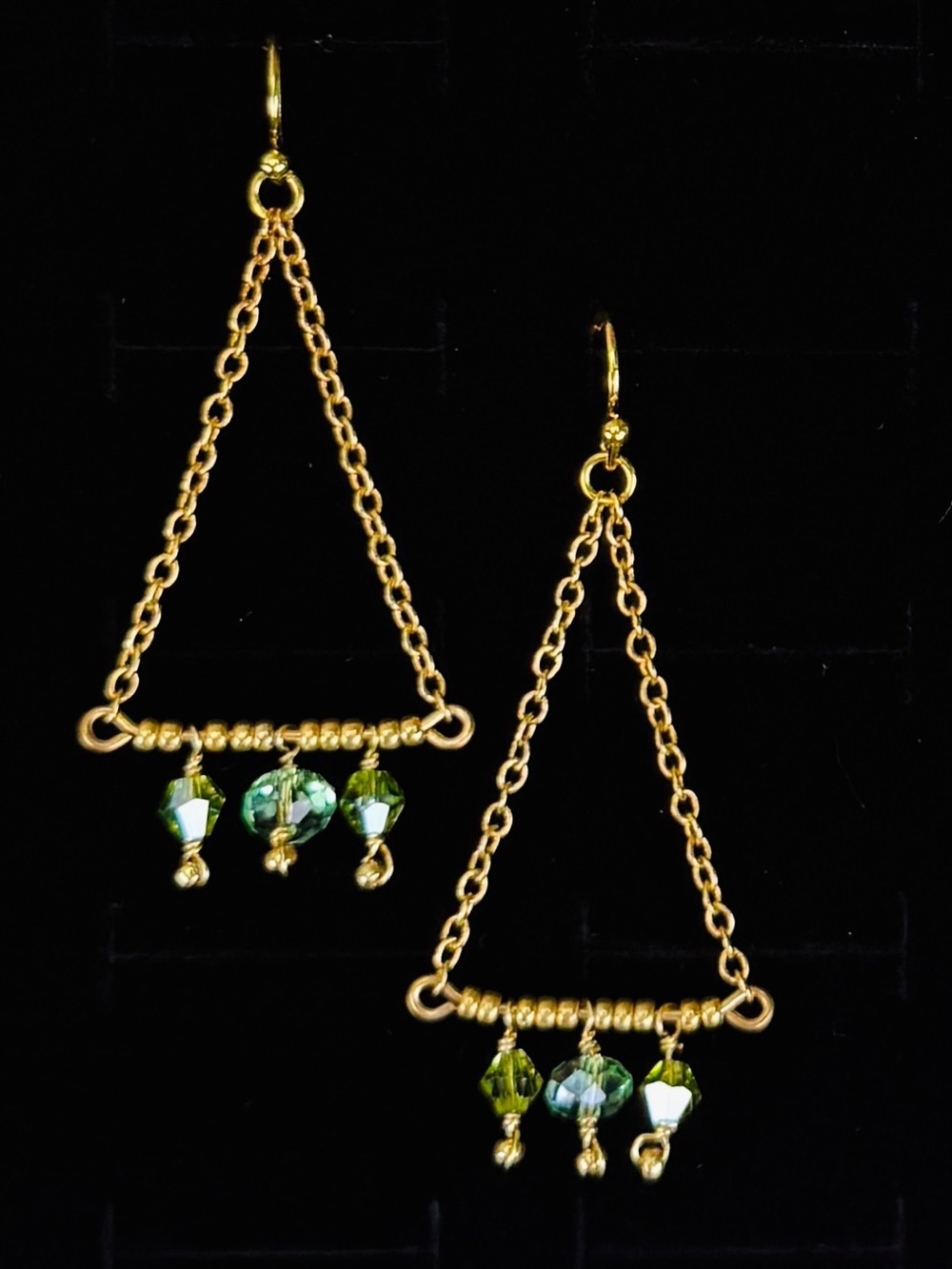 Lightweight, goldtone, green reflective bead, dangle triangle pierced earrings